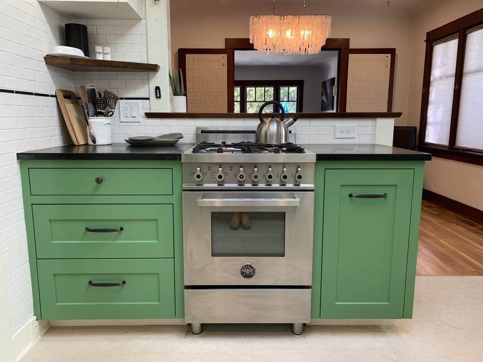 Bertozzini oven and custom cabinets in kitchen.