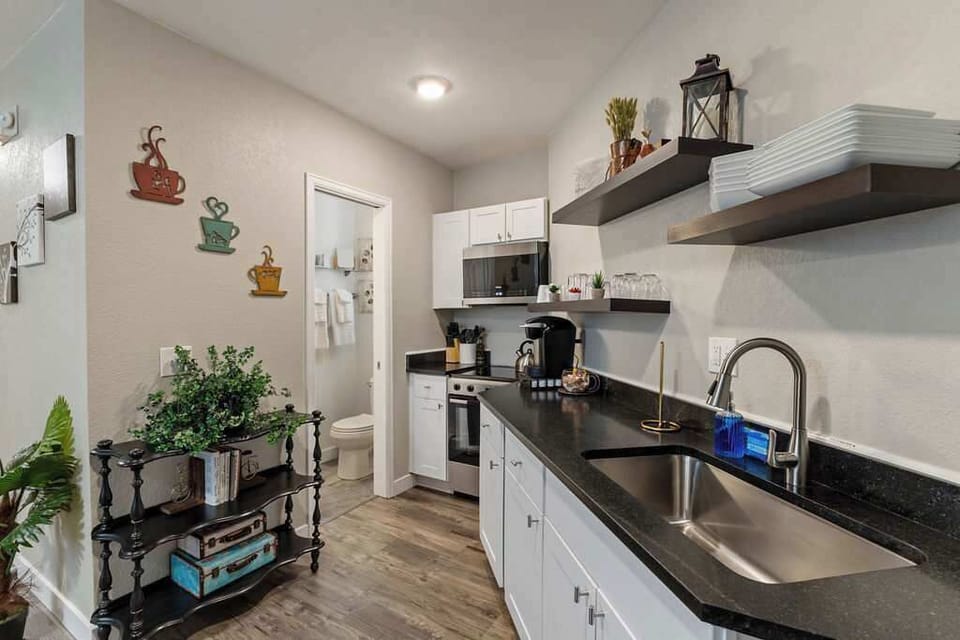 The kitchen has dishes and cookware so you can make a meal. 