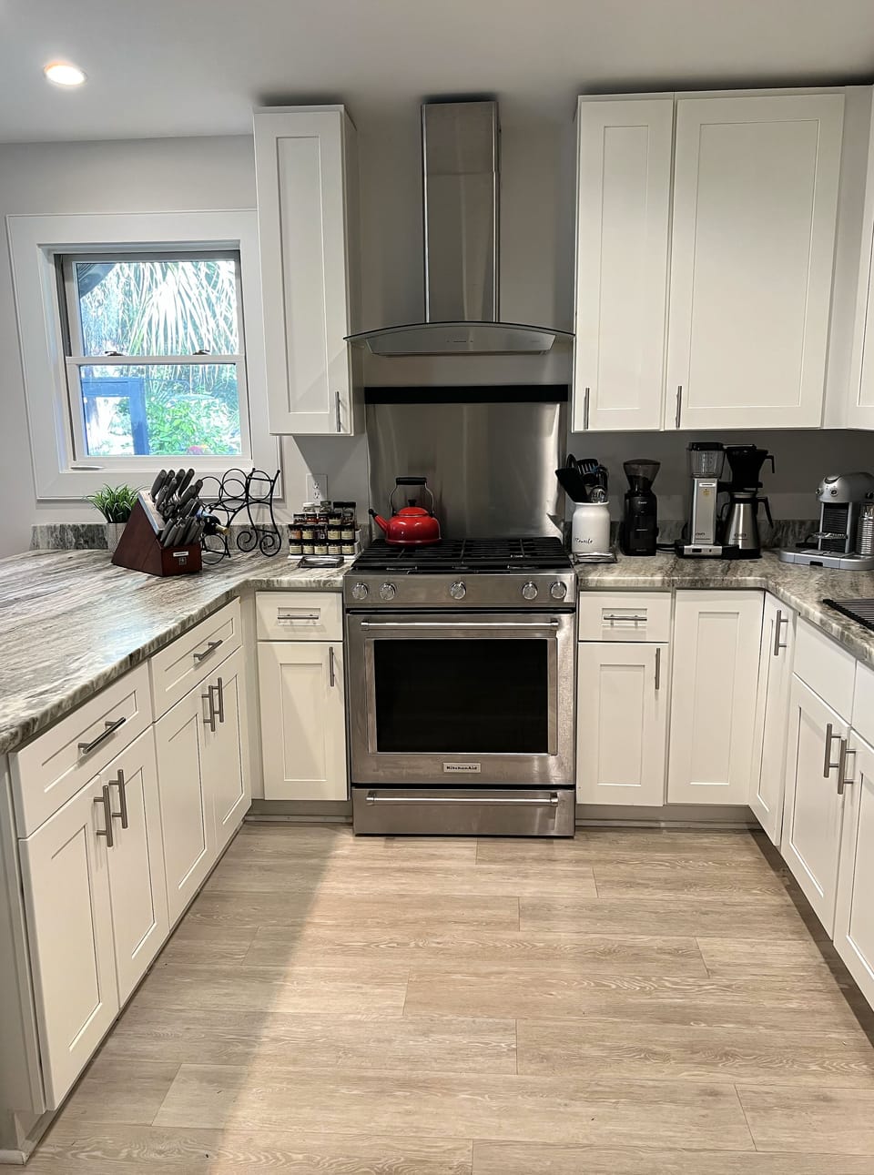 Plenty of counter space, KitchenAid gas range, Henckel knives, plenty of spices 