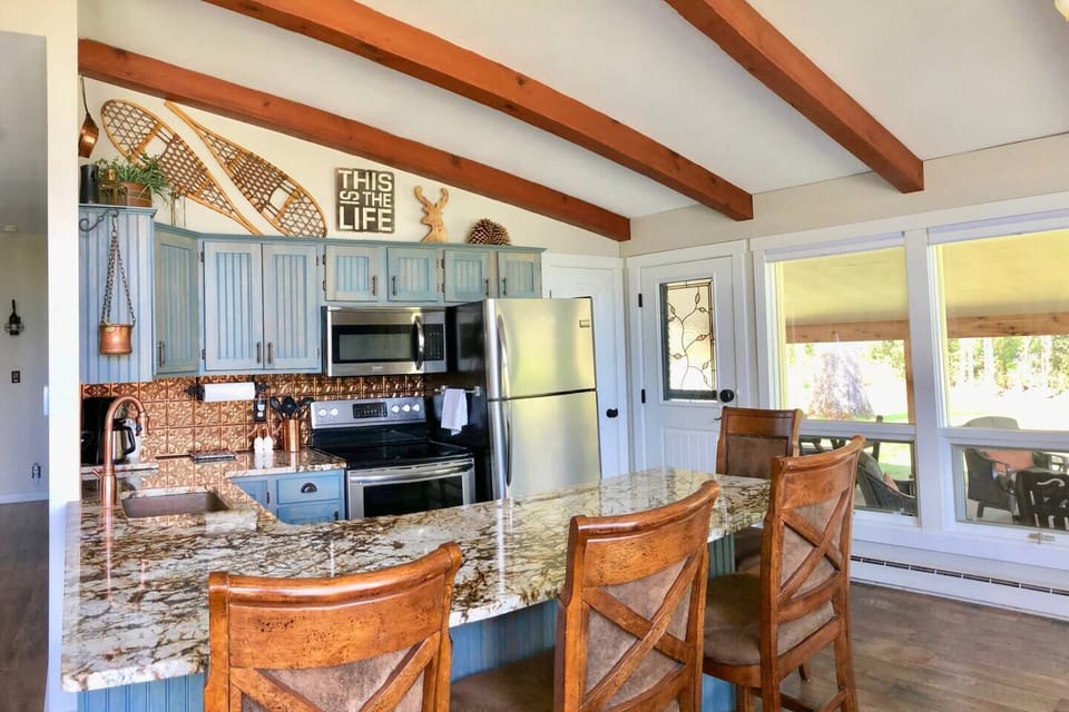 Updated Kitchen with beautiful hammered copper sink and heirloom English copper decor. Newly upgraded Flex-brew coffee maker brews ground coffee by the pot as well as individual k-cup pods. 