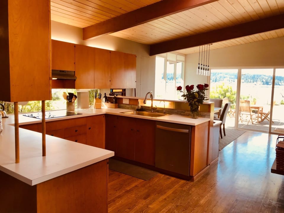 Open plan kitchen for easy entertaining offers lots of storage and cooking tools