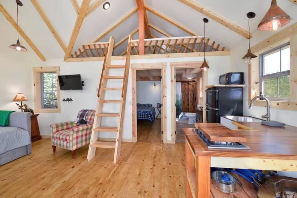 Local cut spruce beam accents on the ceiling and spruce poles incorporated in the railings. 