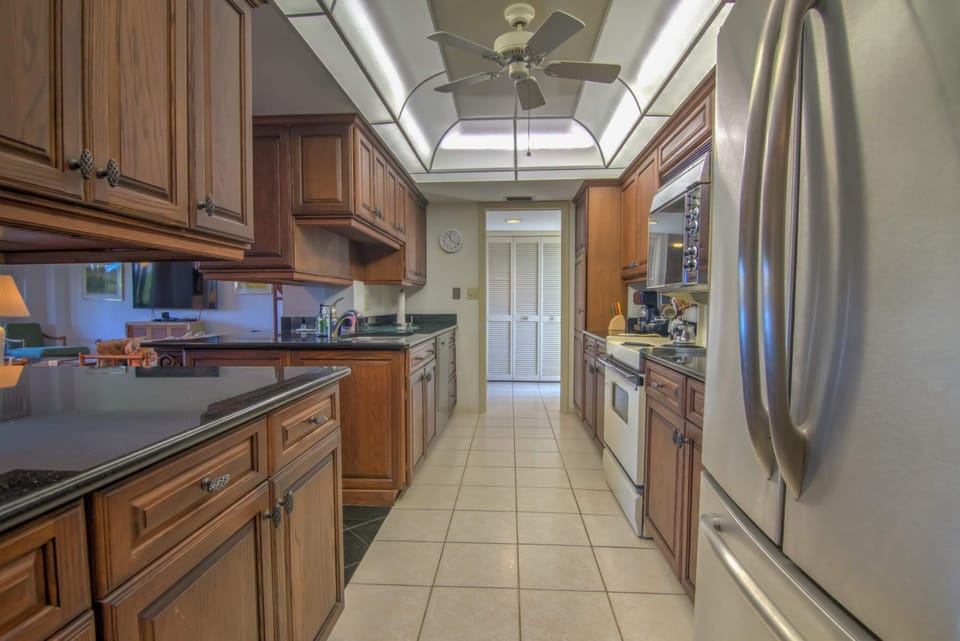 The Kitchen Has Lots Of Cabinets and Counter Space!