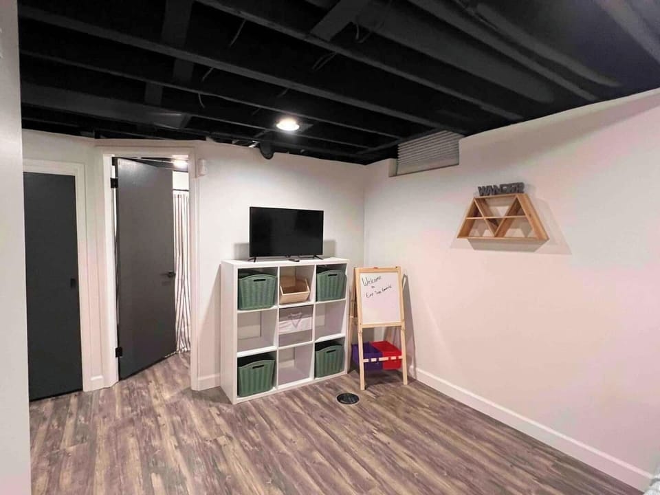 Basement Bedroom with Toys and 32" Smart TV!Not to mention the Tent in the corner (not pictured)