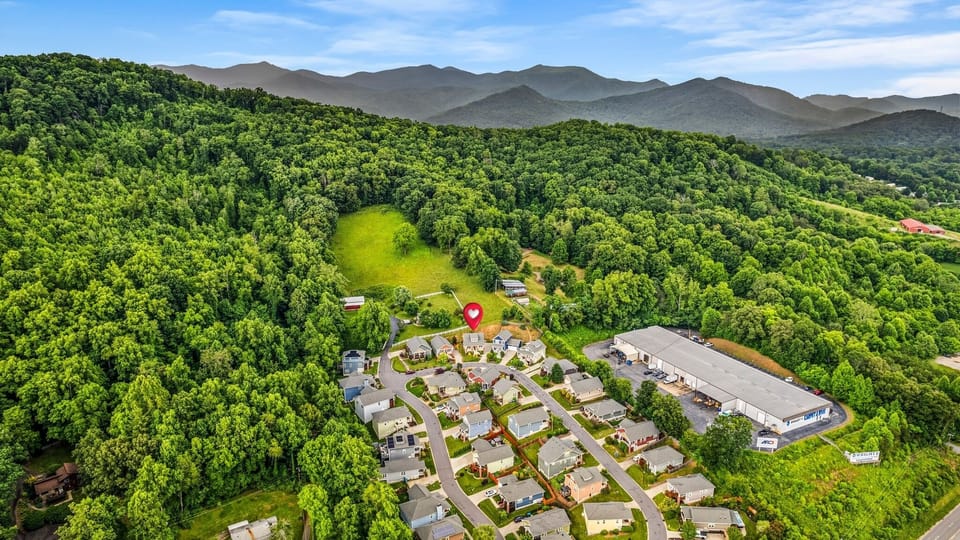 Enjoy beautiful views from the top loop of this charming mountainside neighborhood.   *drone photo facing NNE
