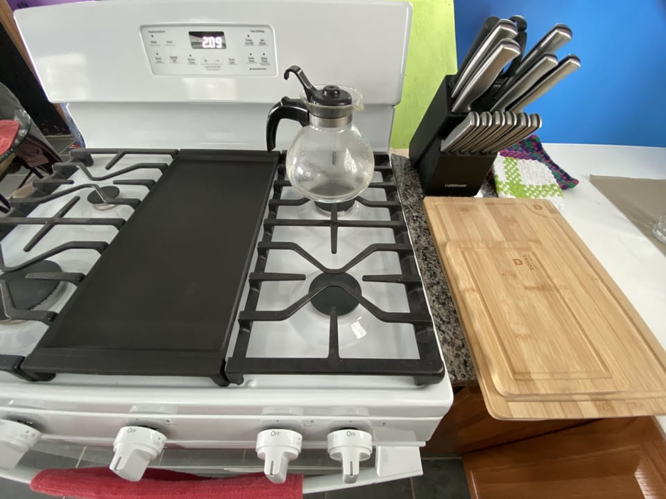 Full size gas stove/oven including griddle cooking surface.