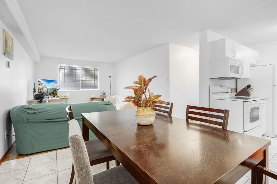 Dining room looking to living room and kitchen 