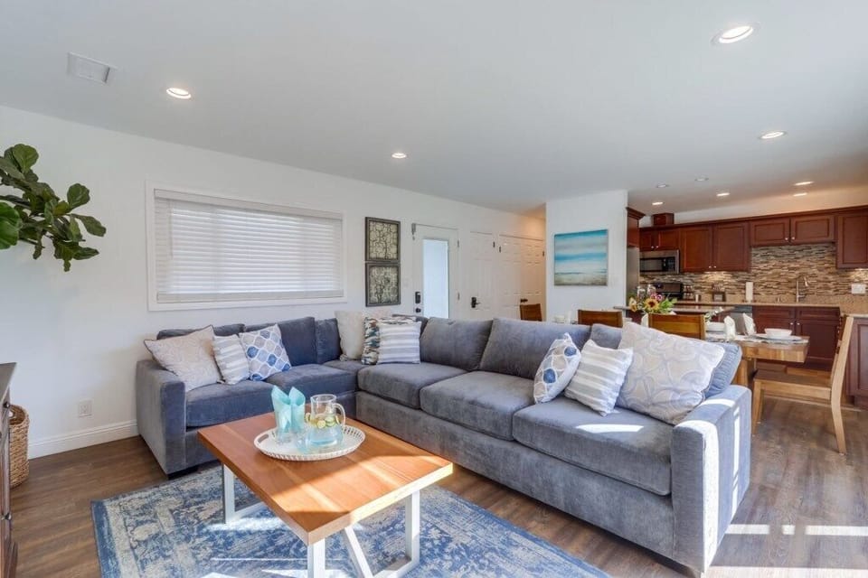Open Concept Main Living Area: Dining Room, Living Room, and Kitchen
Sectional is a queen sized sofa pull-out