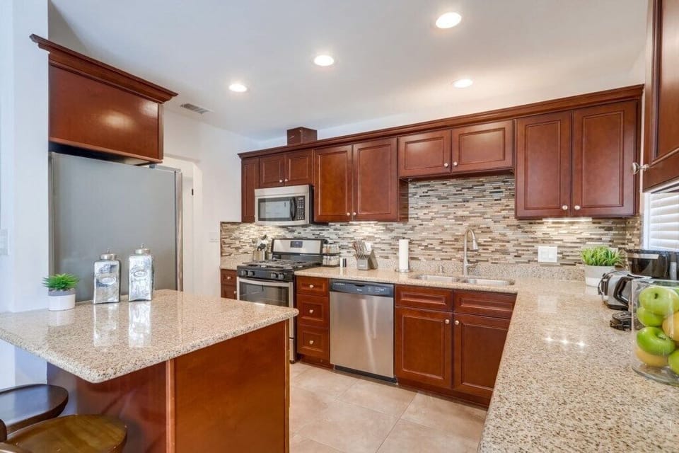 Custom Kitchen with Granite Countertops and Stainless Steel Appliances