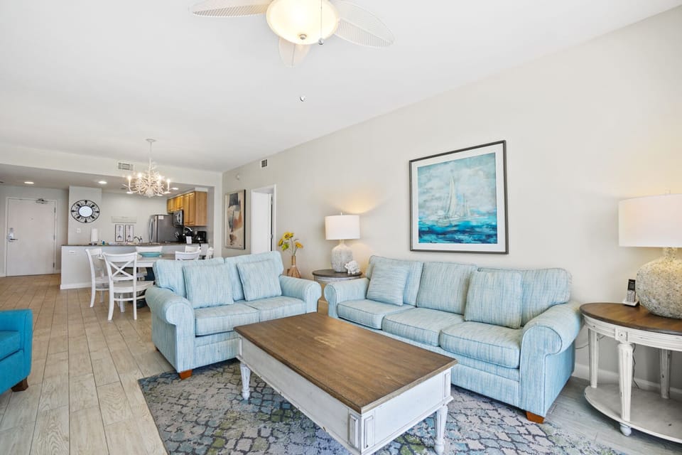 Relax in your coastal-inspired living space with comfortable seating and ocean-themed decor that creates the perfect beach getaway atmosphere.