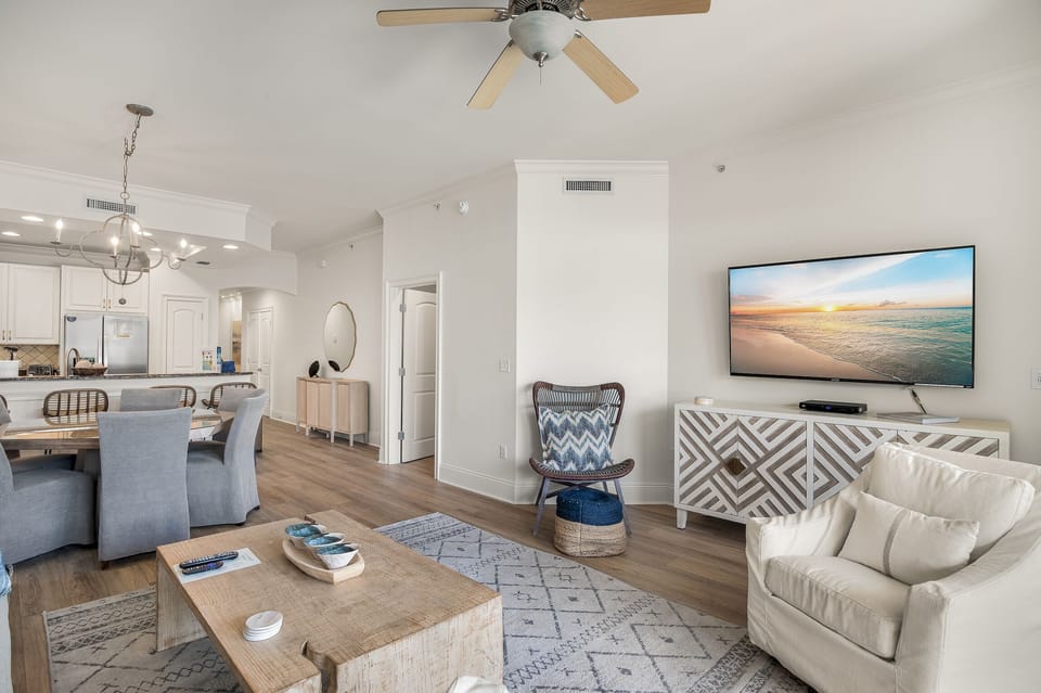 All New floring throughout - Living area with large Smart TV, cable provided to connect devices.