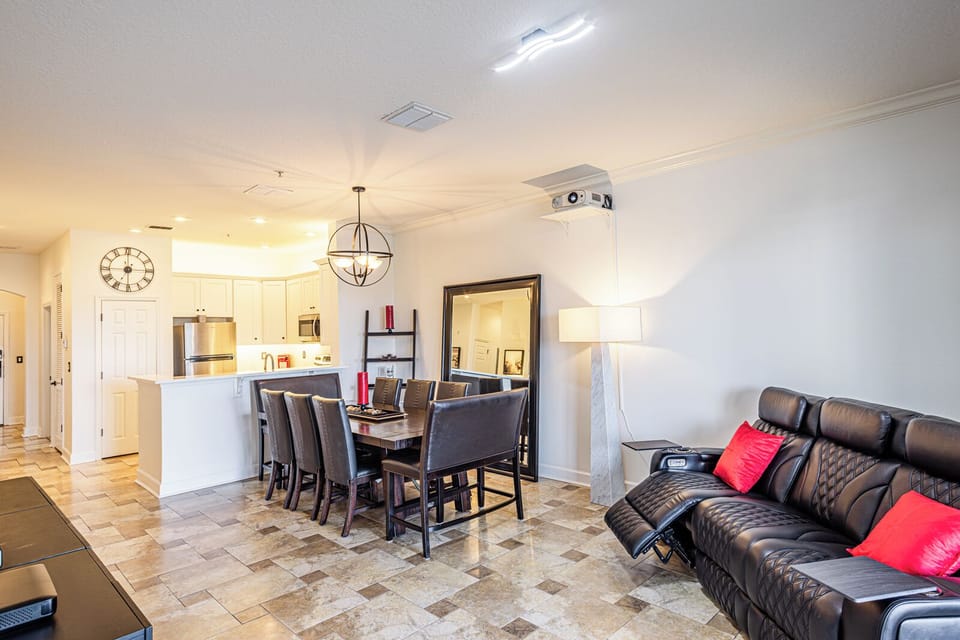 Living Room Comfort: Relax on the Reclining Sofa, Enjoy the Large Screen Smart TV, and WiFi