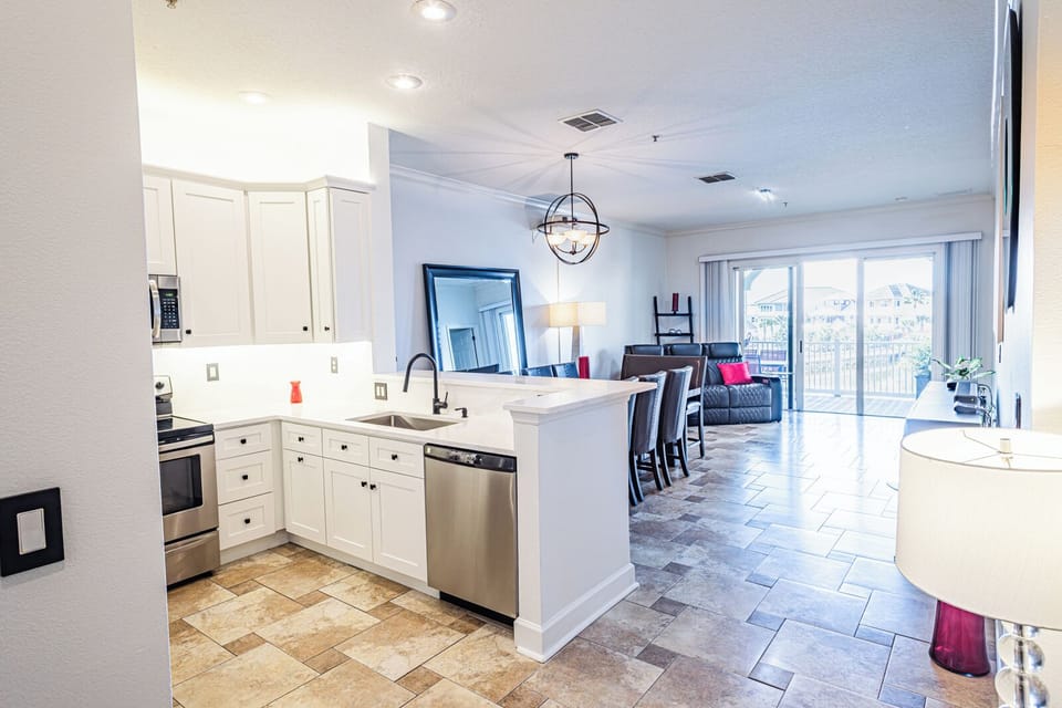 New Renovation: Open Concept Living Area with Quartz Kitchen and Private Balcony Access