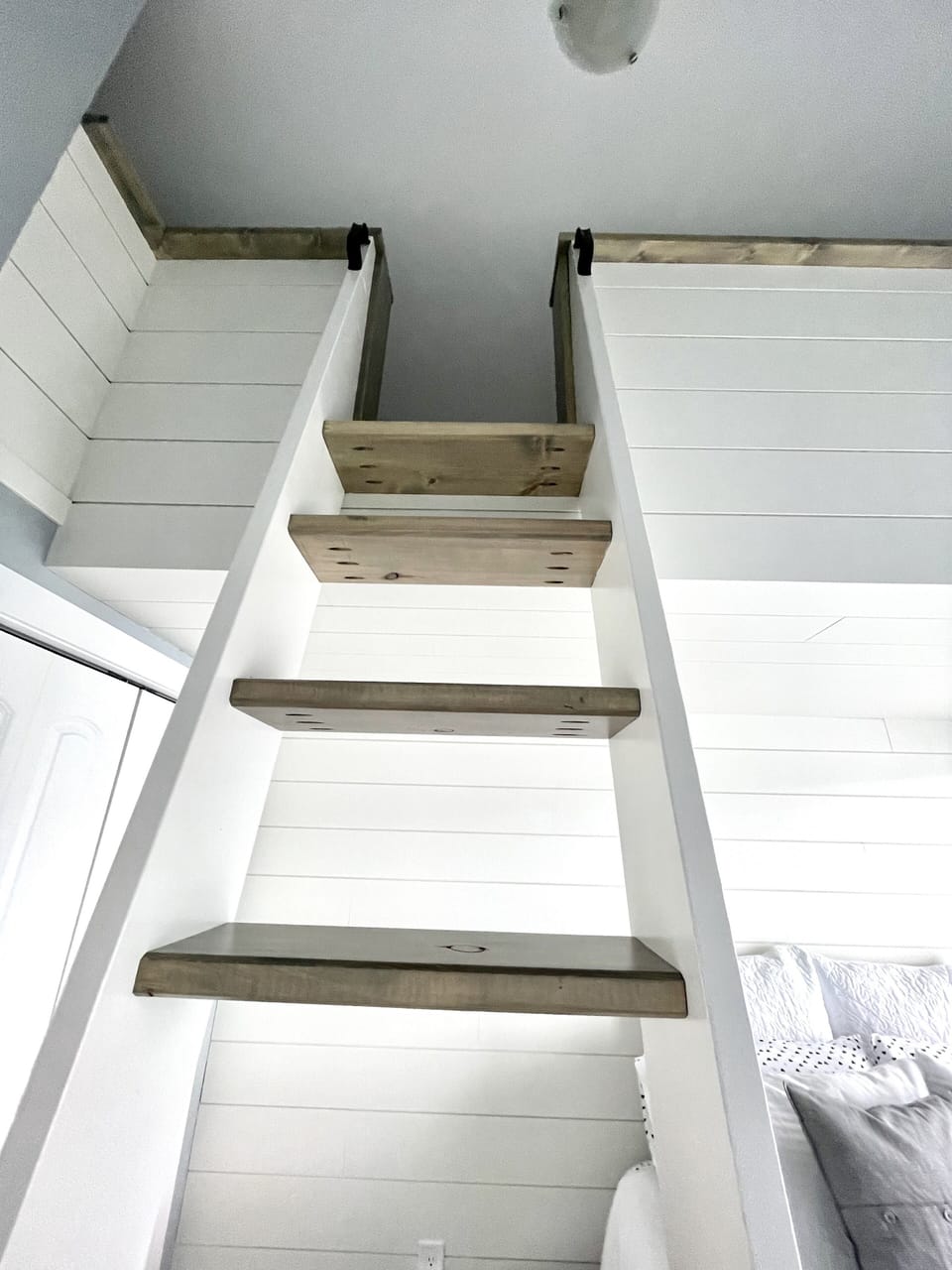 Stair case to loft above. For safety reasons kids aged 7 and up can use loft.  