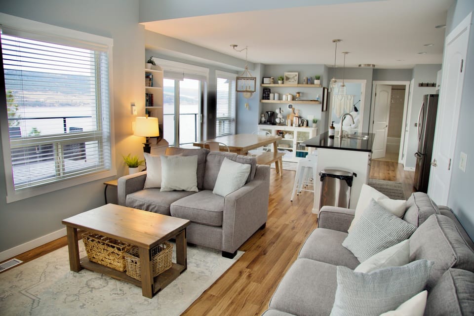 Main floor living area to kitchen and dining room. All with deck and lake view. 