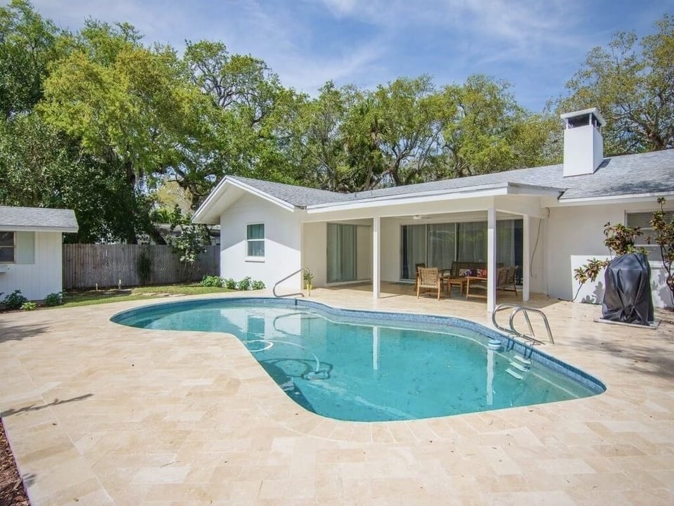 Southern exposure. Ivory travertine pool deck and lanai.