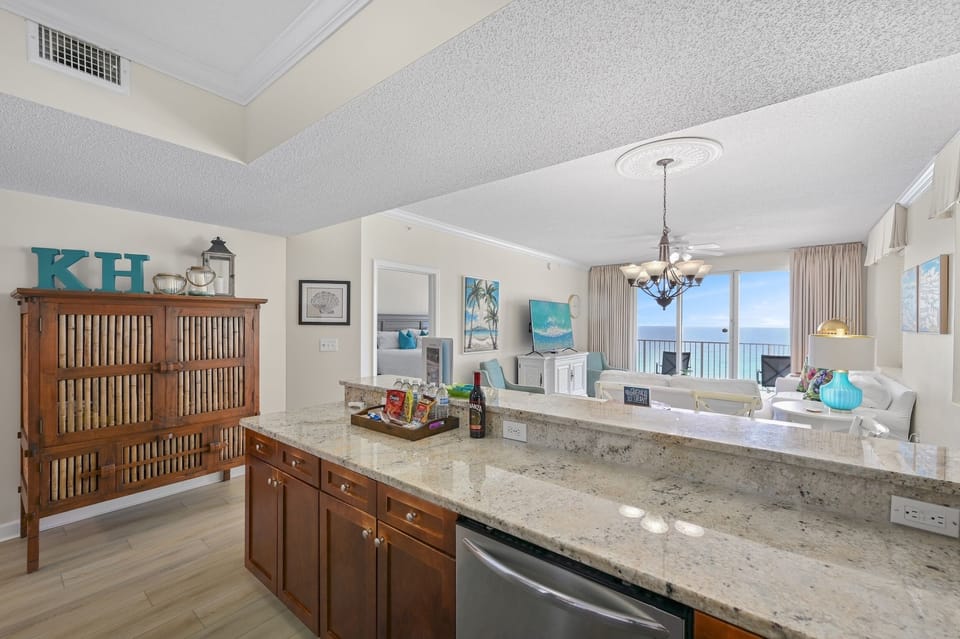 Kitchen has granite countertops, stainless appliances - fully stocked with more than the basics (coffee/tea bar, oils/spices, Tupperware, plenty of pots/pans/cookware)