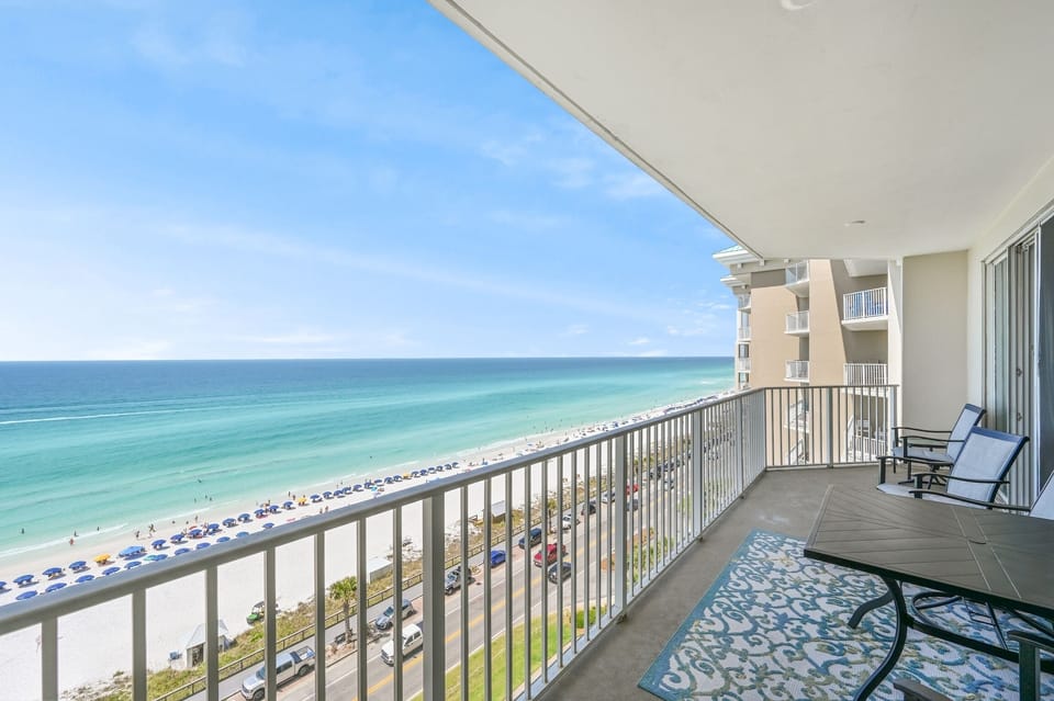 Spacious patio with plenty of seating, perfect for soaking in those Emerald Coast Views - accessible from the living room AND Master bedroom