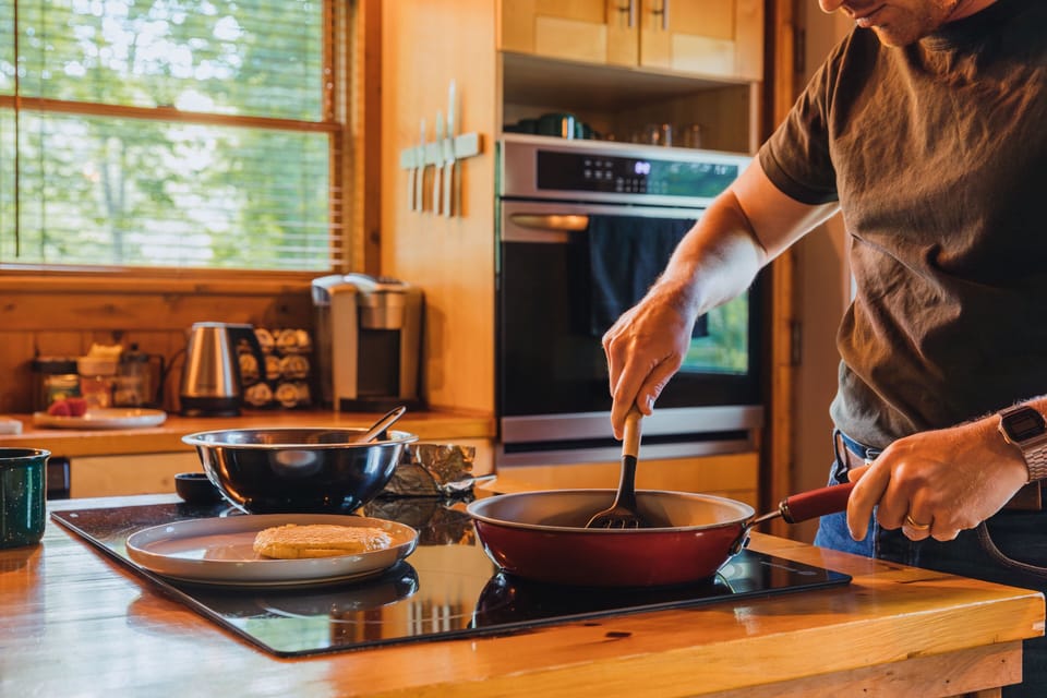 Cook up delicious meals in the sunlit kitchen, featuring ample counter space, modern appliances, and an open layout. Whether prepping breakfast or hosting dinner, it’s a bright, functional space for gathering and creating.