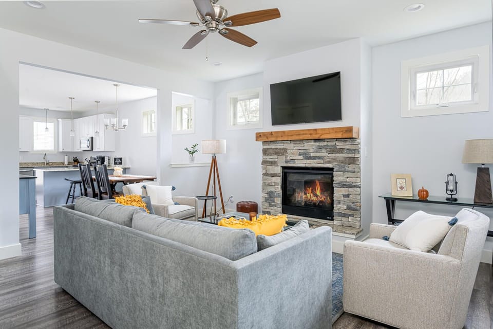 Living room with flat-screen tv and gas fireplace.