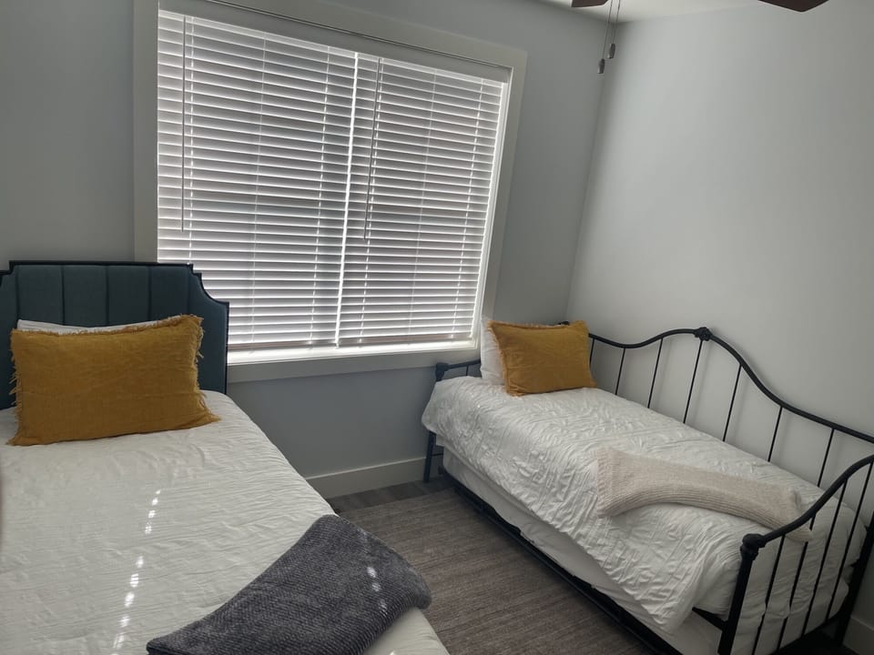 The third bedroom, second-floor, with Twin XL and Twin with trundle. 