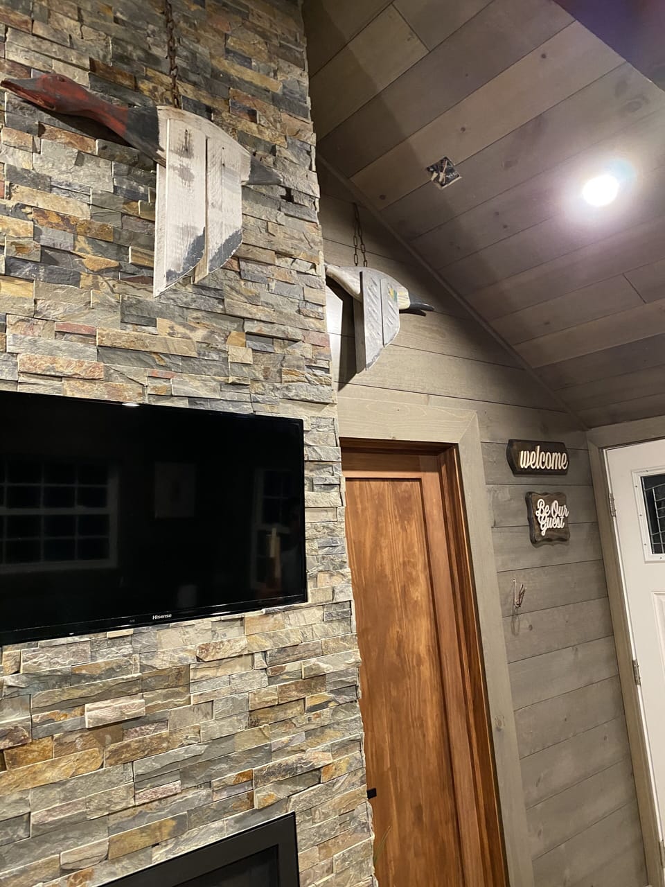 Smart TV mounted above the fire place. Beautiful and charming decor. 
