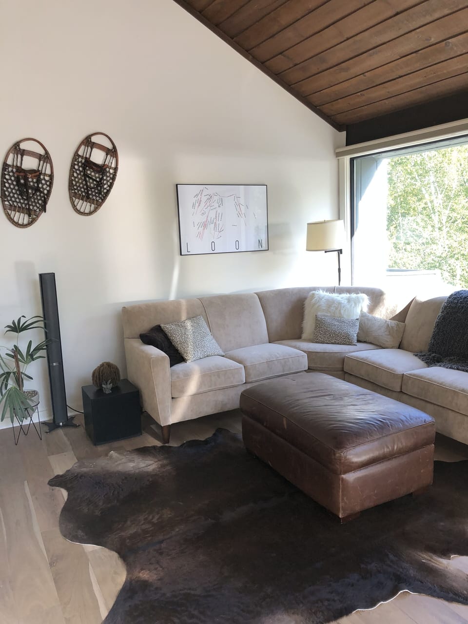 Cozy couch and ottoman for relaxing after a day on the mountain
