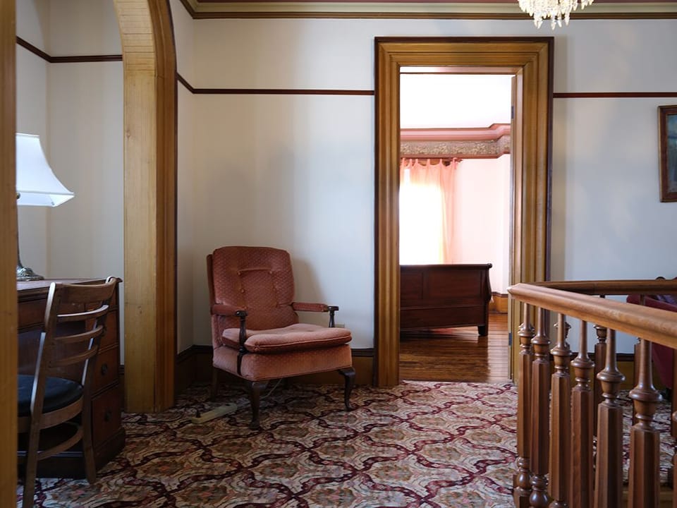 More of the Hallway with a Writer's Desk to the Left facing out.
