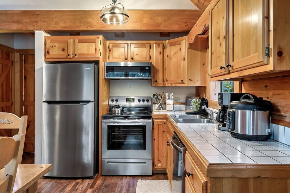 Recently updated kitchen with stainless steel appliances and full compliment of cookware for the family.