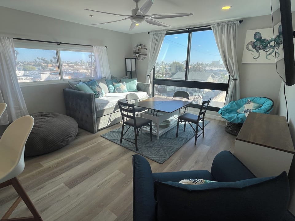 Living room with coffee table open and chairs