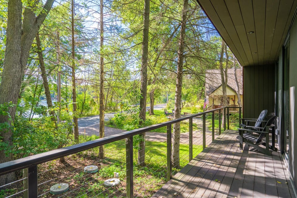 Unwind on your private deck surrounded by towering trees, where dappled sunlight creates the perfect retreat for morning coffee or evening relaxation.