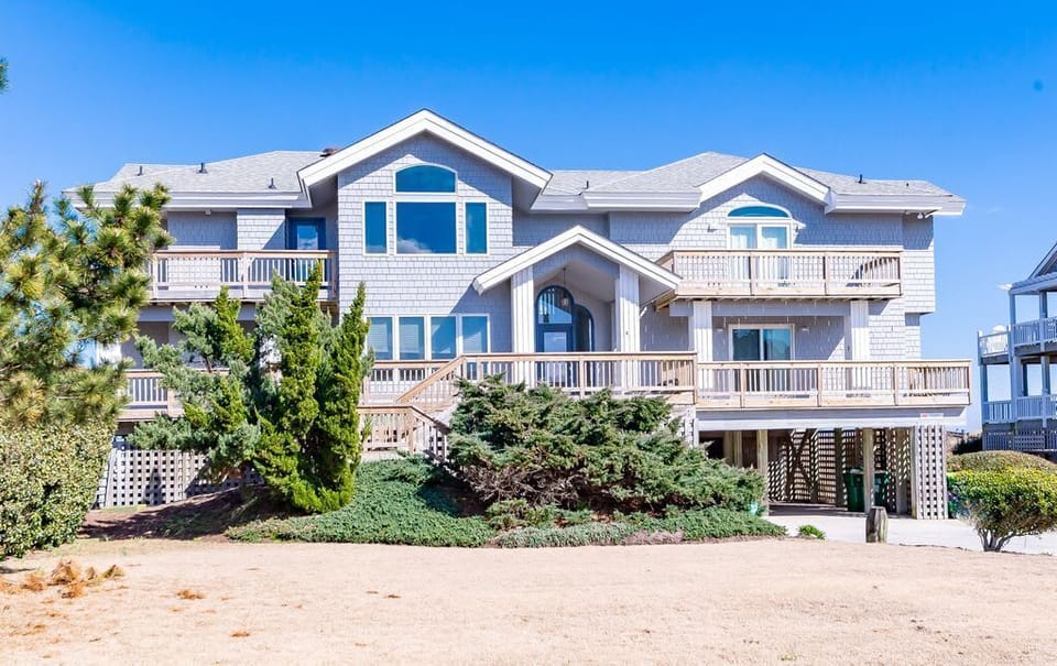 Front View - 4 balconies across three bedrooms and the kitchen for sunset views!