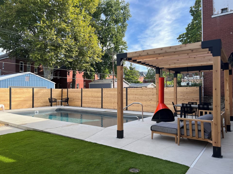 Shared backyard includes heater saltwater pool and patio. 