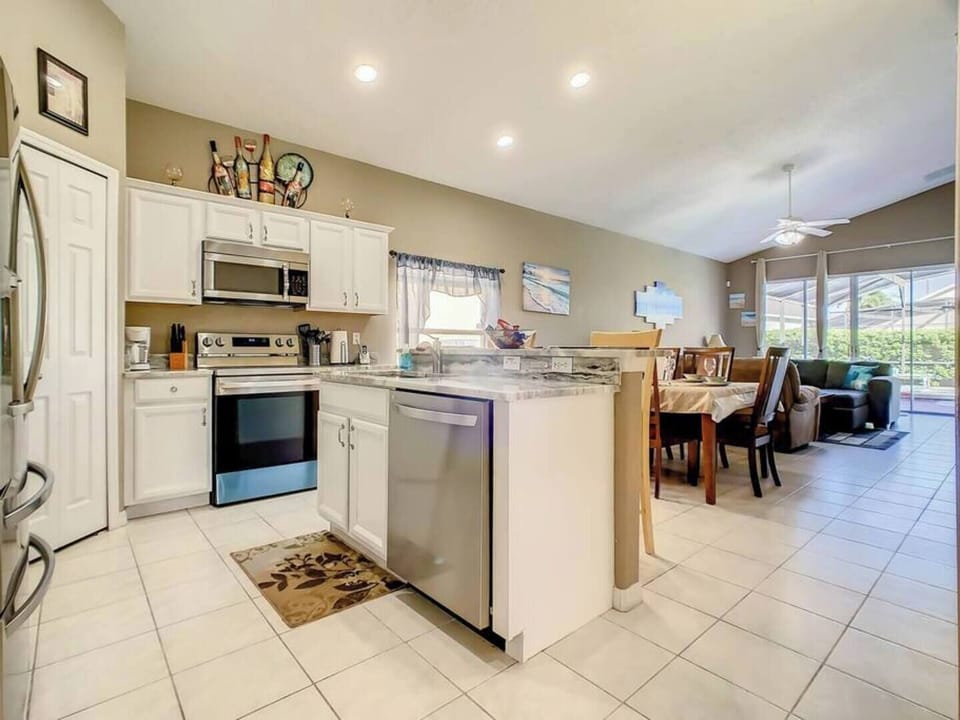 Cook your favorite meals in this fully equipped kitchen with modern appliances.