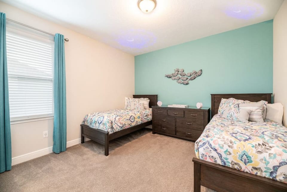 Two twin sized beds with Jack n Jill bathroom