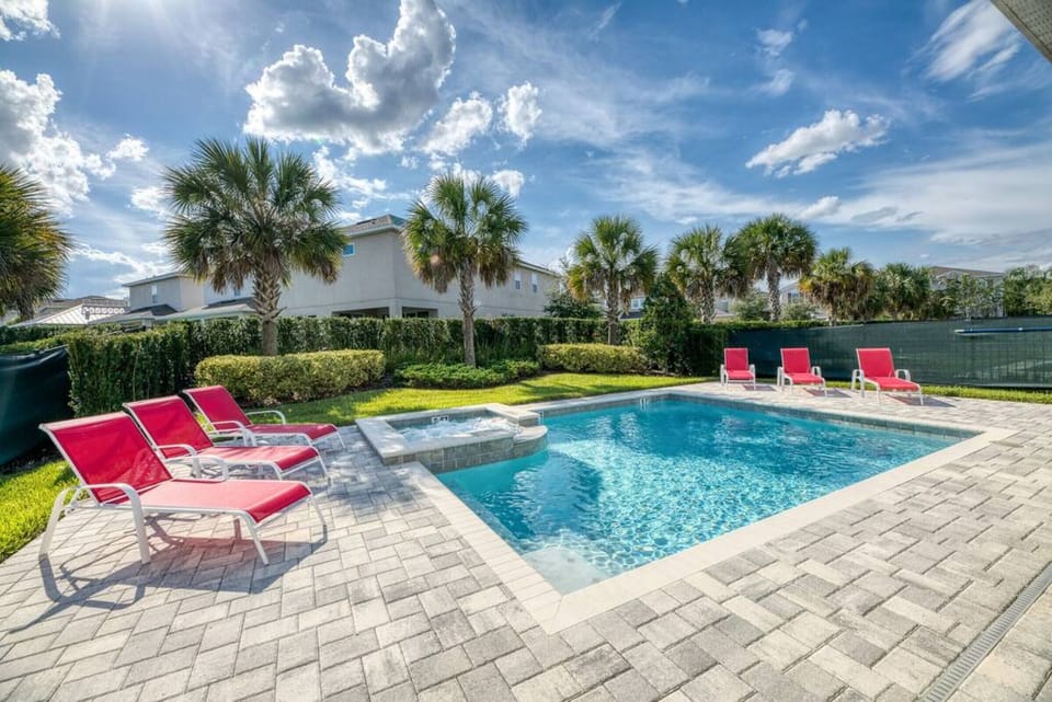 The home includes heated pool and hot tub (POOL HEAT INCLUDED) -A lawned area behind the pool