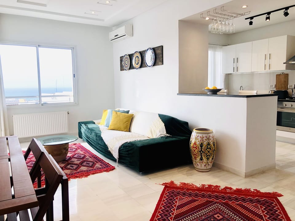 Modern open space living room with direct access to the kitchen. 