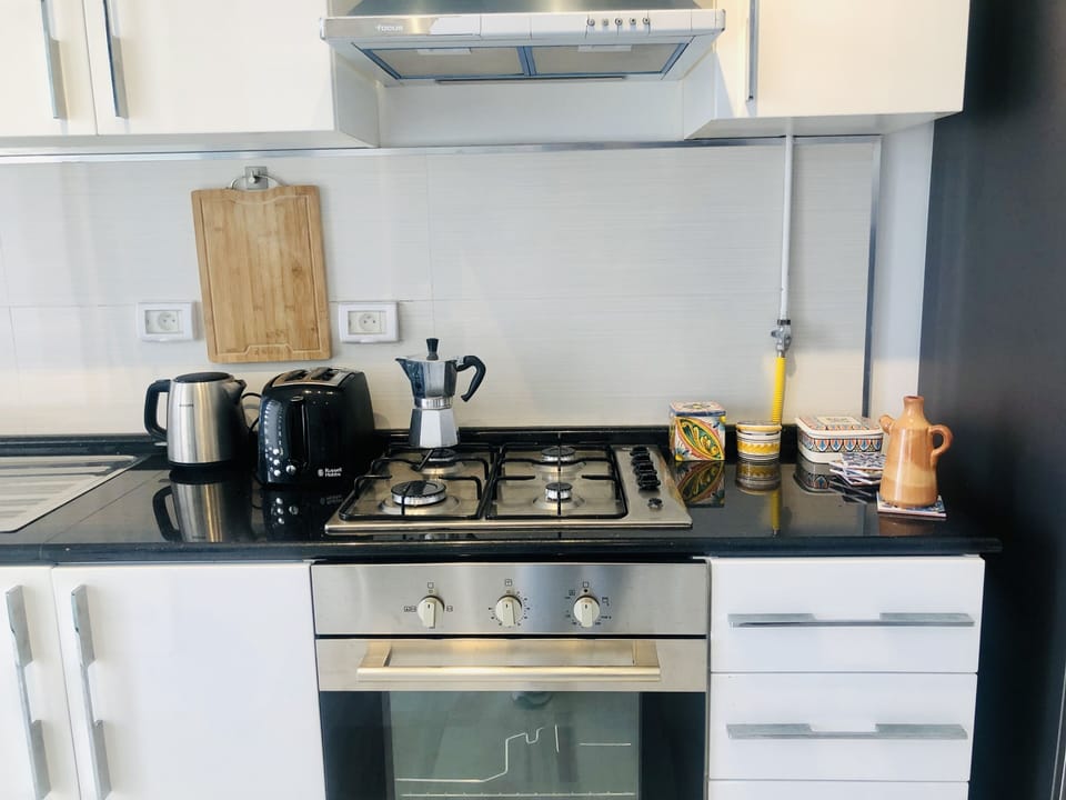 Italian „Bialetti“ espresso machine, a kettle, coffee, tee , sugar, cutlery ...