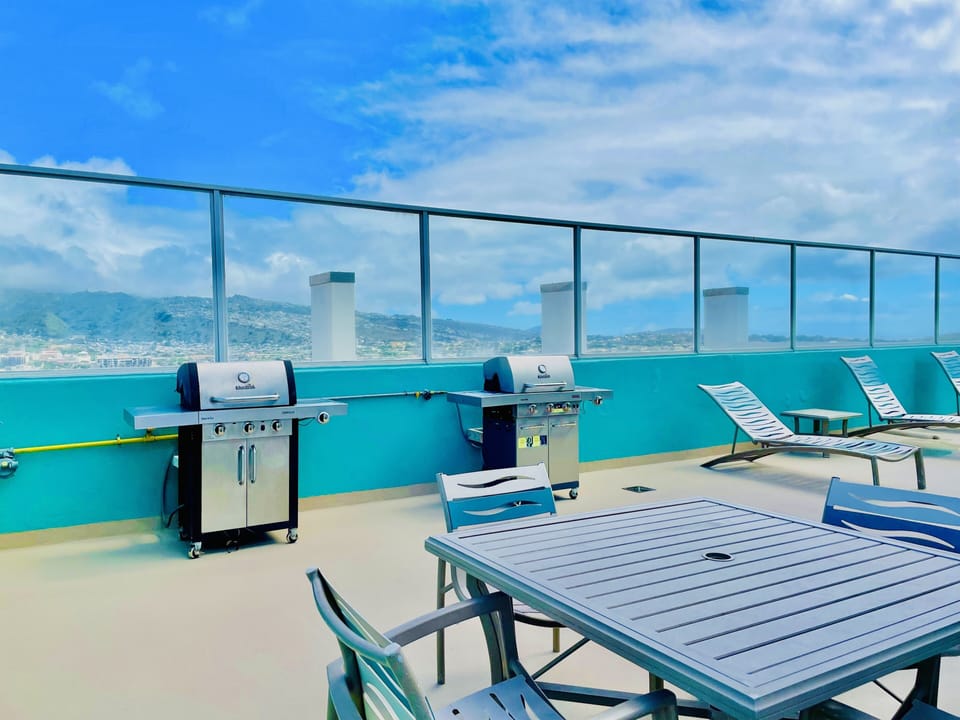 BBQ grills and picnic area on rooftop 