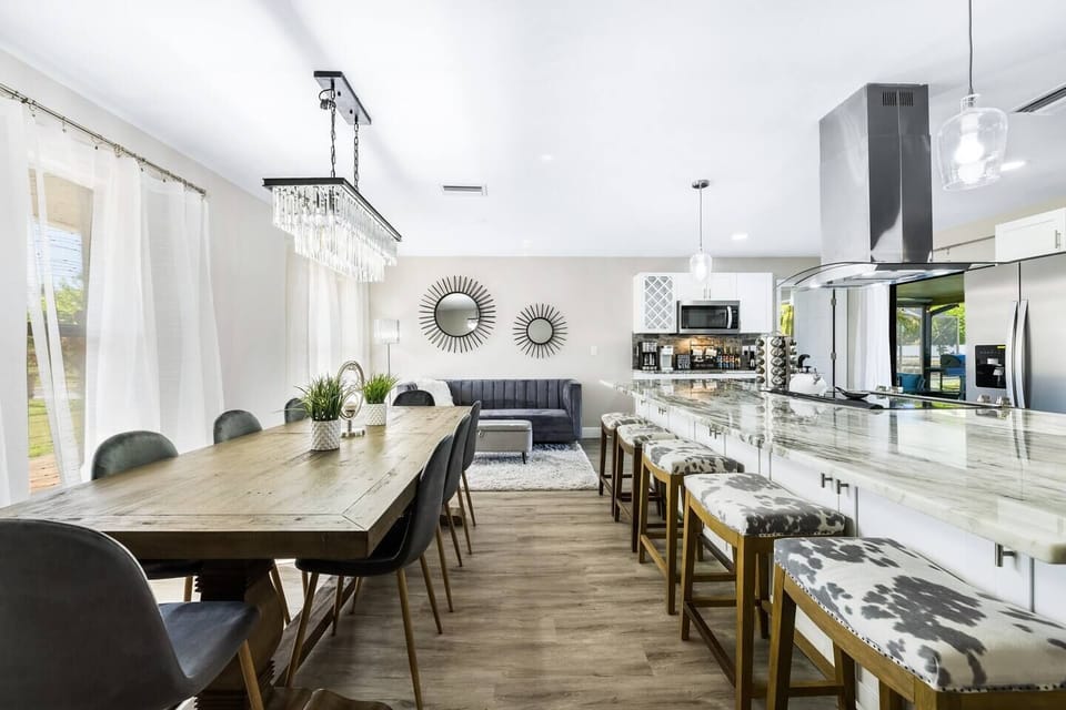 Spacious dining area and oversized kitchen island—perfect for gathering, cooking, and sharing meals together.