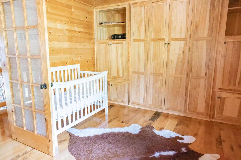Upper Level Office (with doors for privacy).  Queen murphy bed and crib. 
