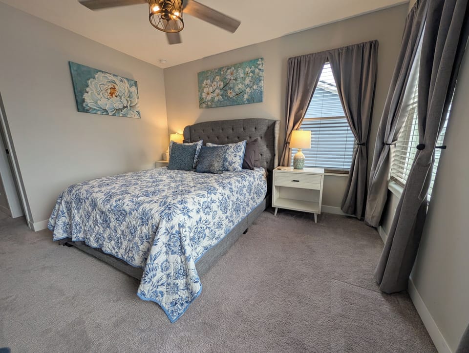Guest Bedroom with Queen bed, ceiling fan and 50" smart tv