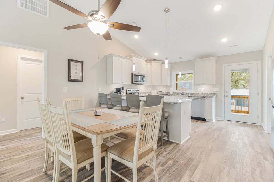 Spacious kitchen and dining room for everyone to gather around and enjoy their favorite meals together.