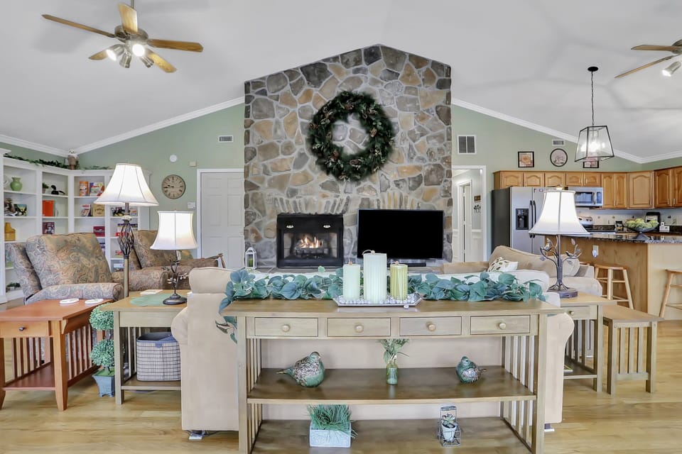 Cozy fireplace next to a 65" 4K UHD TV in the Great Room.