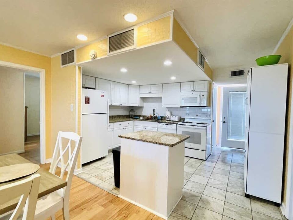 Whip up breakfast with ease in this bright and modern Myrtle Beach kitchen.

