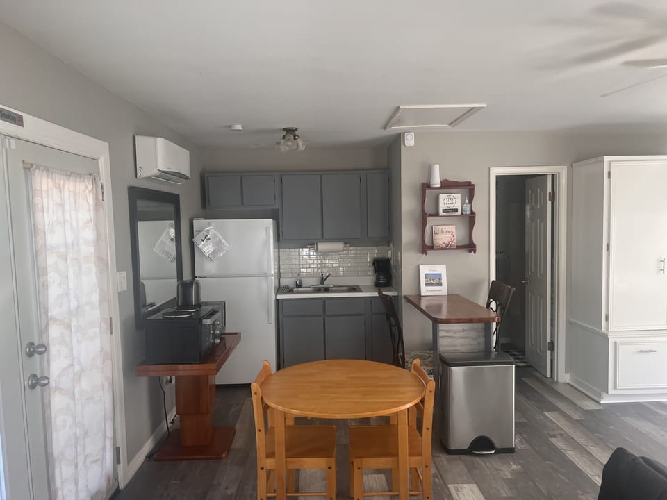 Kitchen has Microwave, Toaster, Oven, Two Hot Plates, Pans, Pots & Utensils