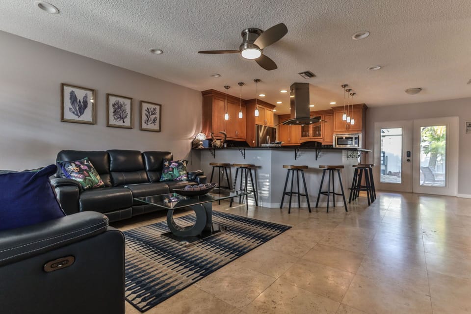 Open Concept family room and kitchen with entry to patio.