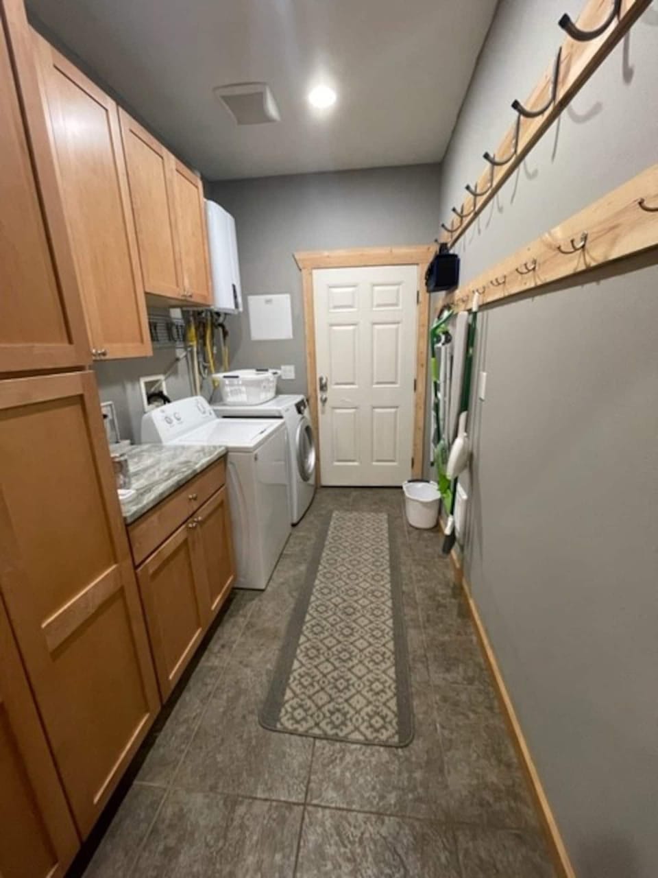 Laundry room off the kitchen. Tons of hooks to hang wet clothes, coats, etc.