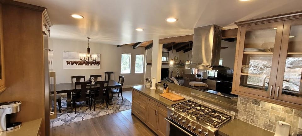 Kitchen with high end appliances adjacent to dining area 