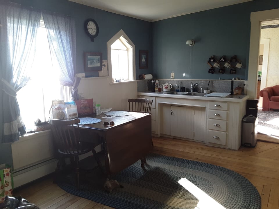 Kitchen and dining room with backyard lake views
